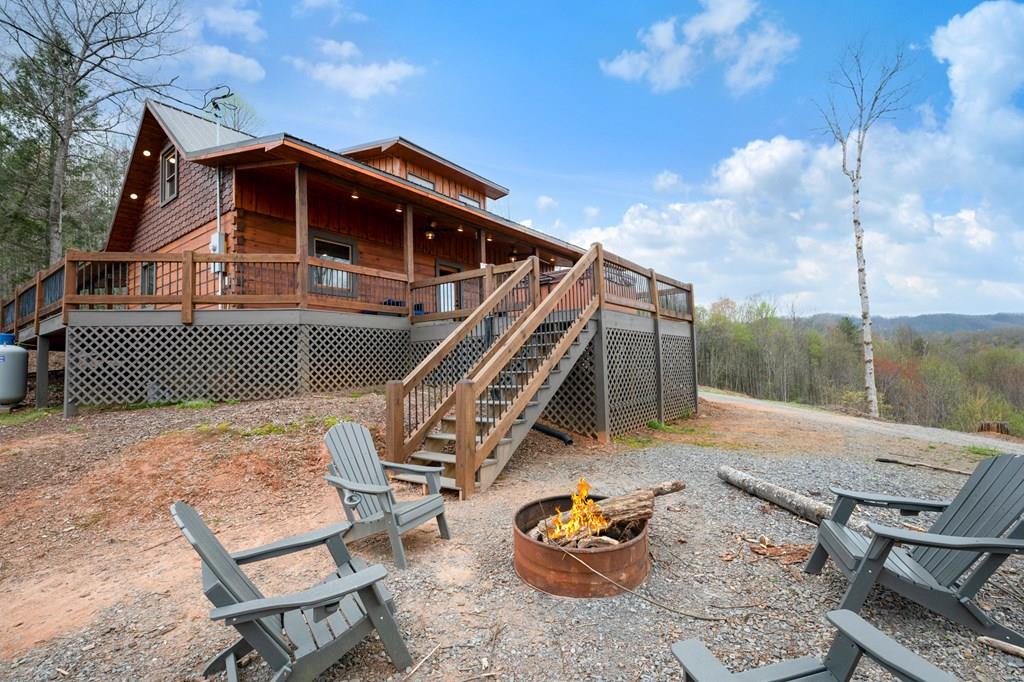 136 A Pack Creek Road Blue Ridge, GA 30513 - Photo 65 of 66 a front view of a house with a yard