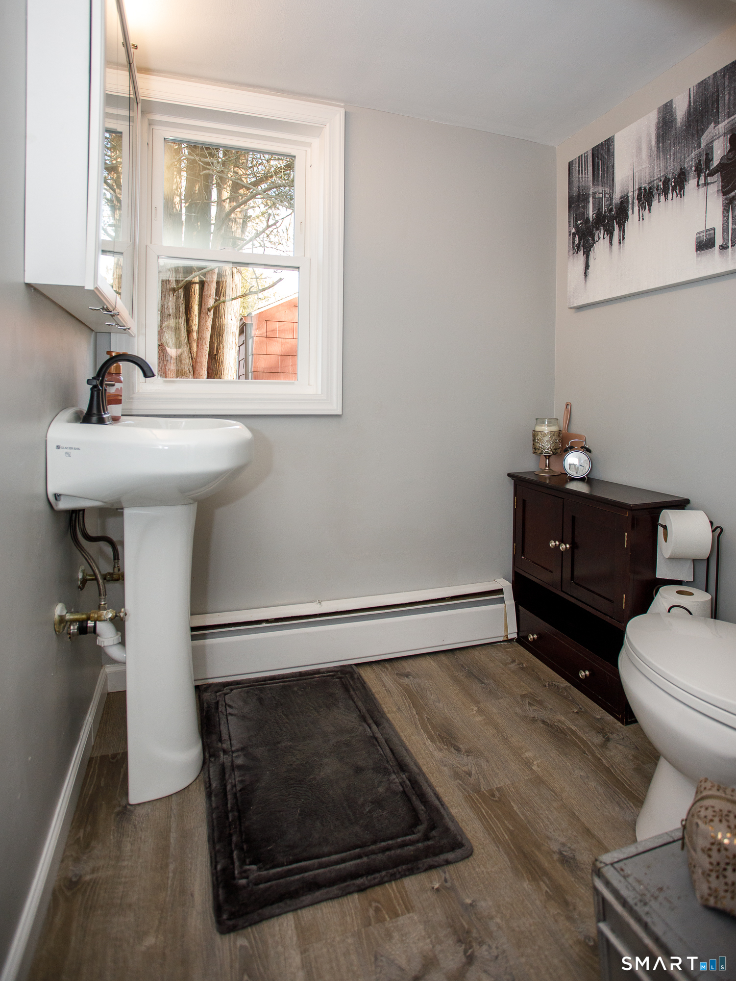 18 Richards Grove Road Waterford, CT 06375 - Photo 13 of 23 a bathroom with a sink toilet and a mirror