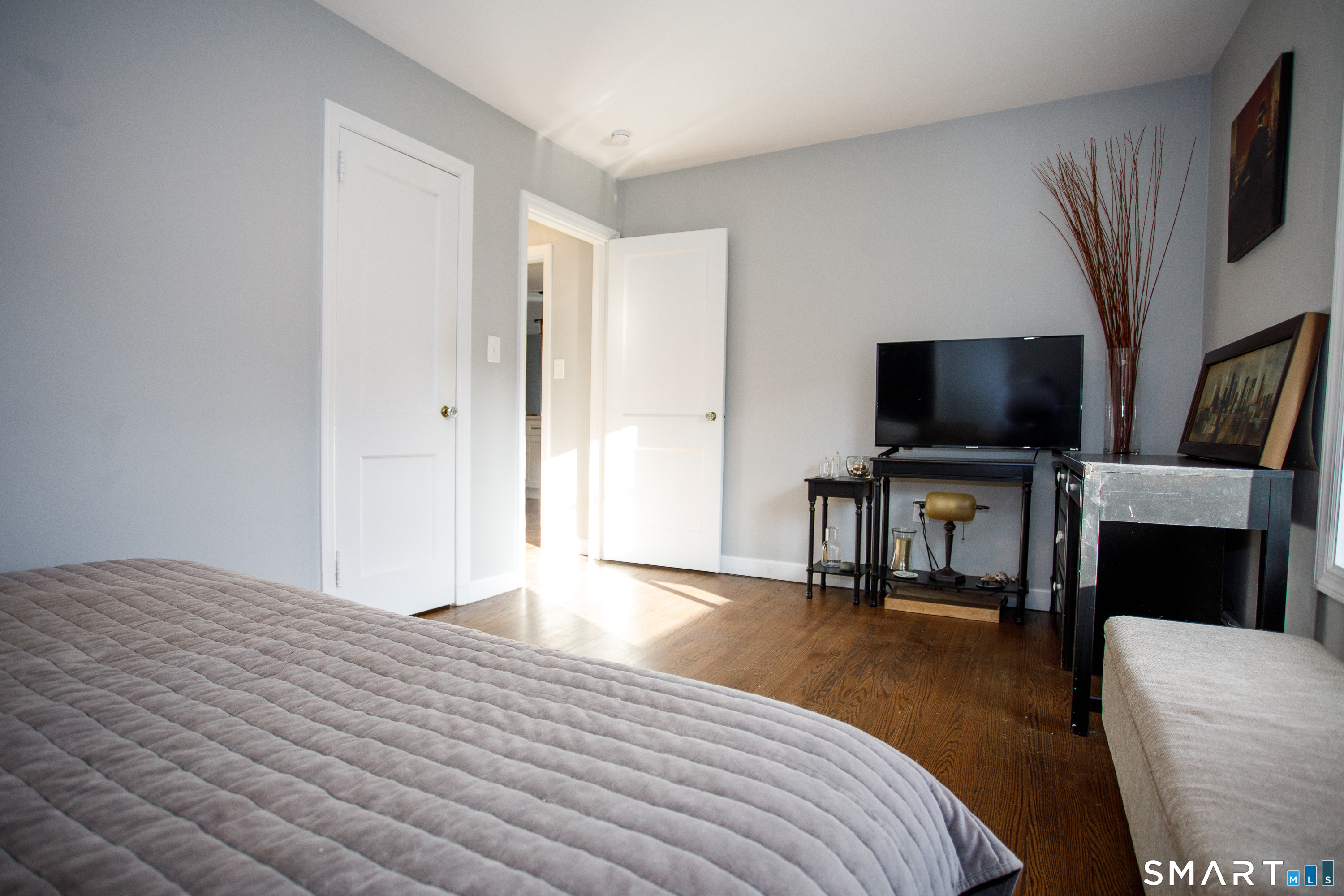 18 Richards Grove Road Waterford, CT 06375 - Photo 15 of 23 a bedroom with a bed and a flat screen tv