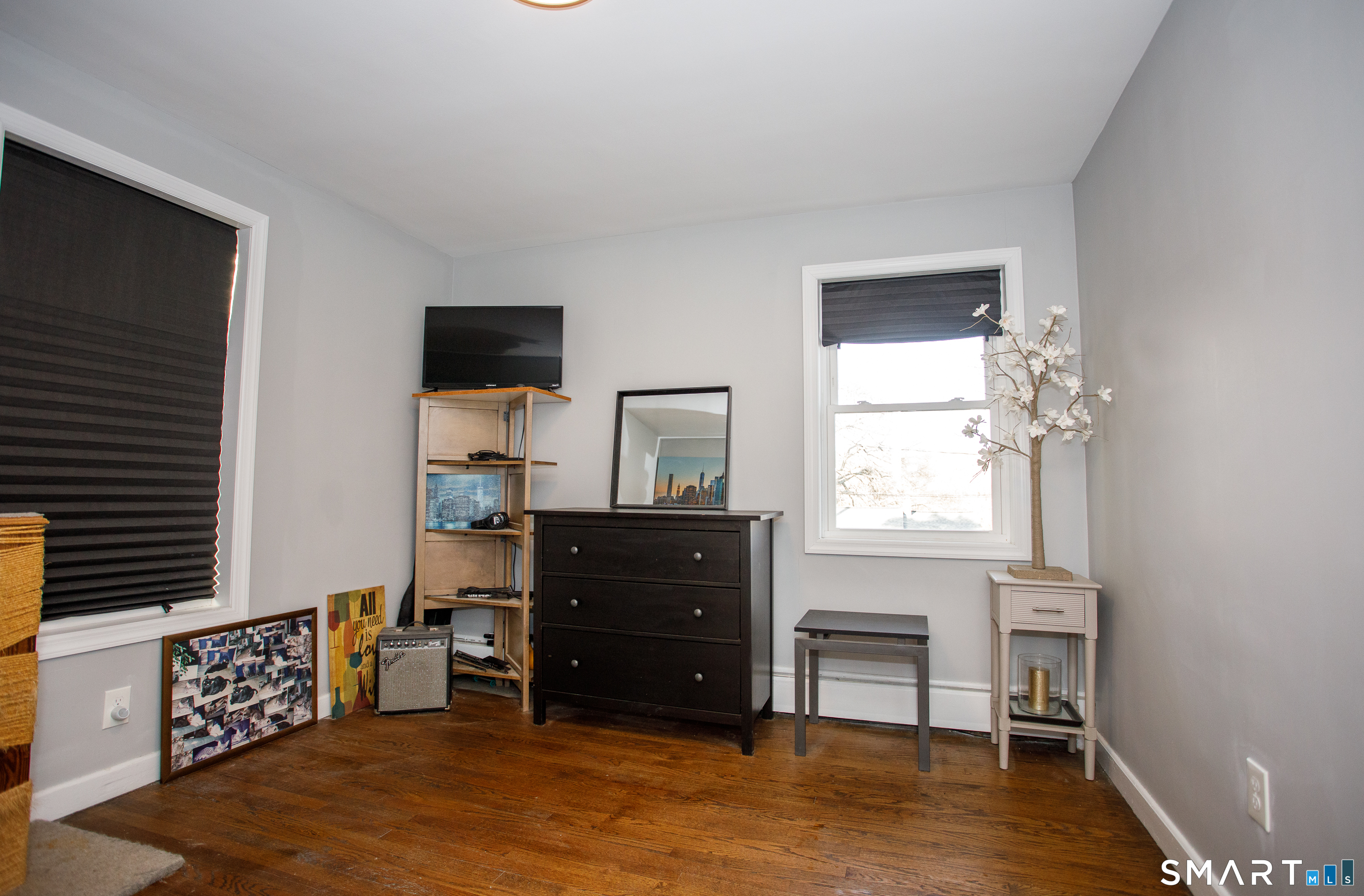 18 Richards Grove Road Waterford, CT 06375 - Photo 16 of 23 a living room with furniture and a flat screen tv
