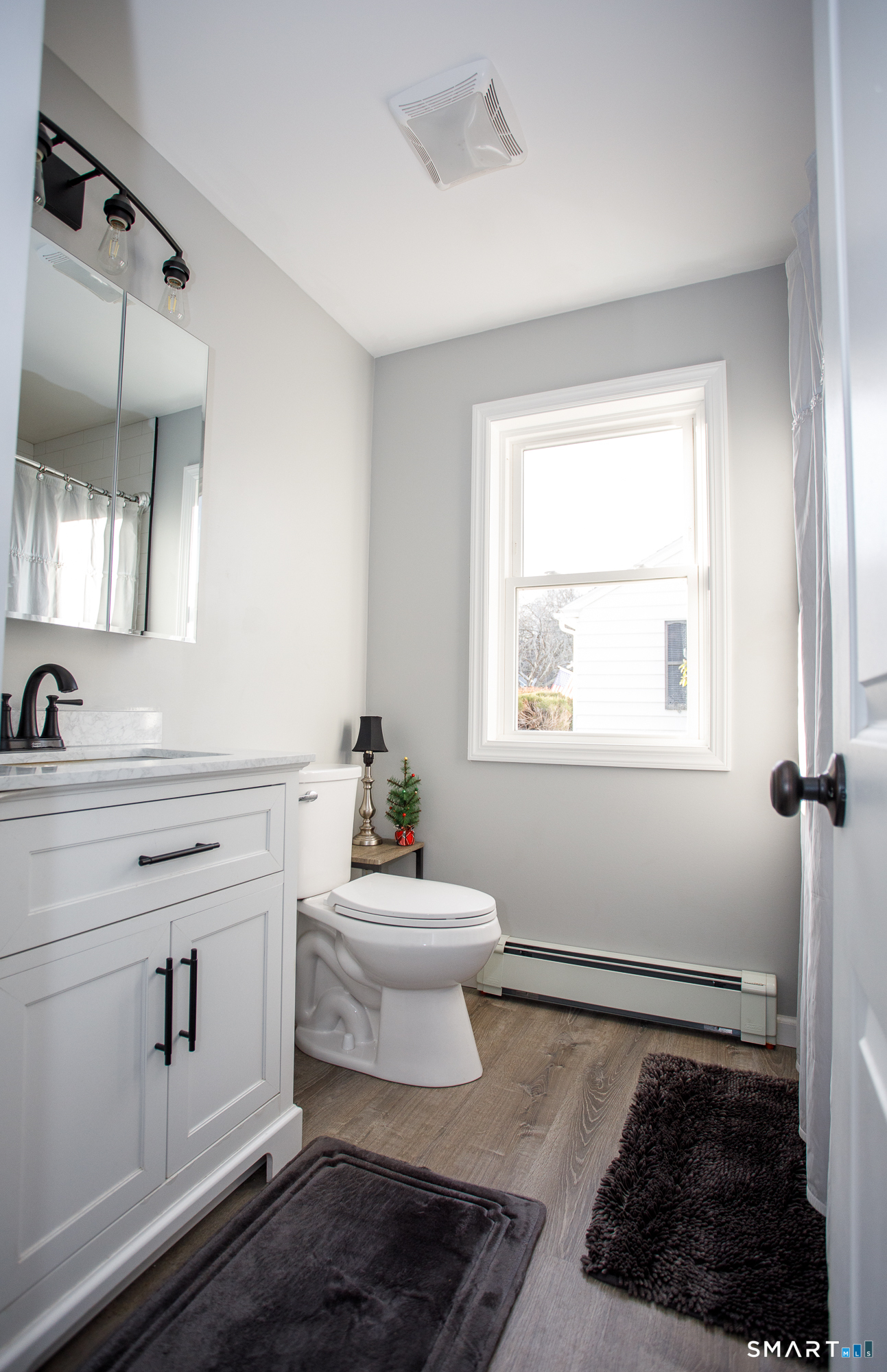 18 Richards Grove Road Waterford, CT 06375 - Photo 17 of 23 a bathroom with a sink toilet and vanity
