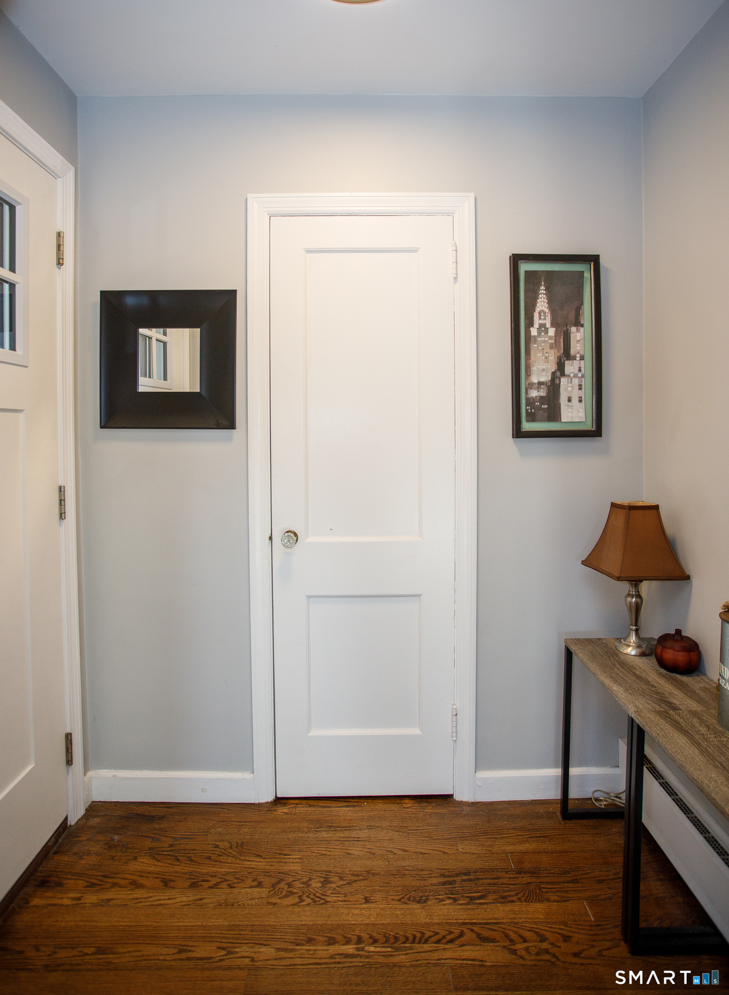 18 Richards Grove Road Waterford, CT 06375 - Photo 22 of 23 a view of a livingroom with wooden floor and a cabinet