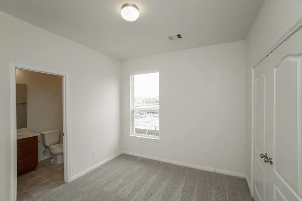 a bathroom with a bathtub and a toilet