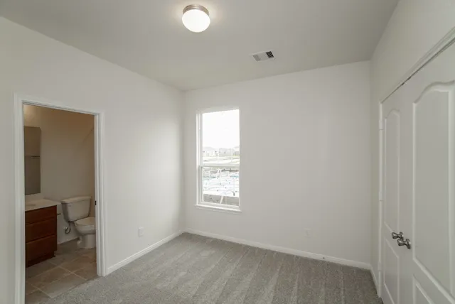 a bathroom with a bathtub and a toilet