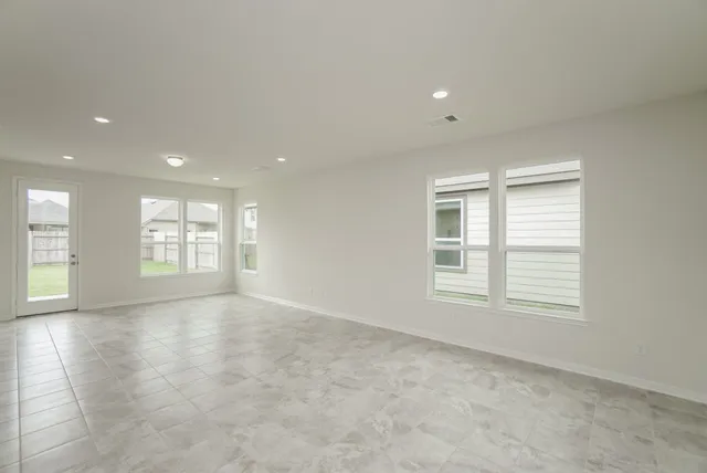 a view of a kitchen with kitchen island a sink stainless steel appliances and a counter top