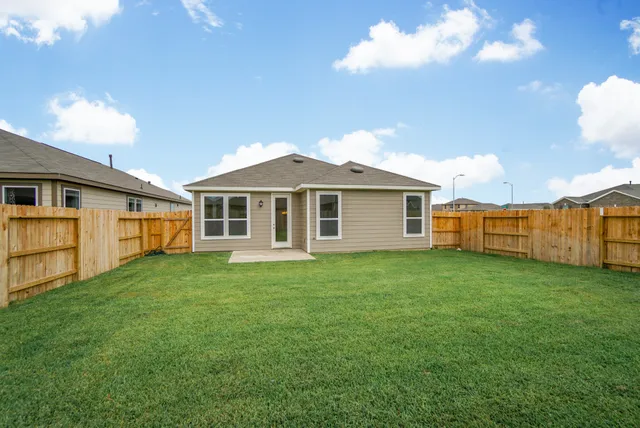 a front view of a house with yard