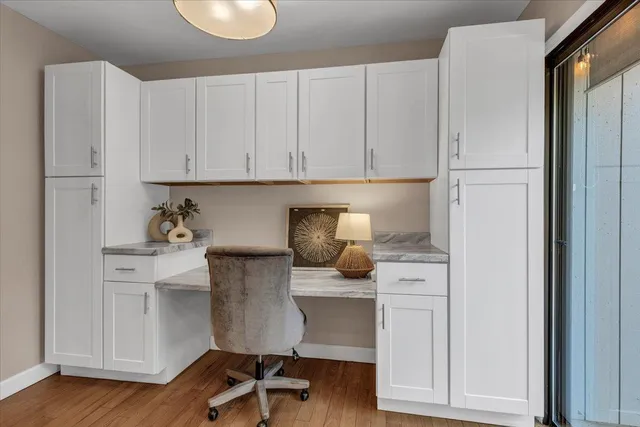 a kitchen with a refrigerator and cabinets