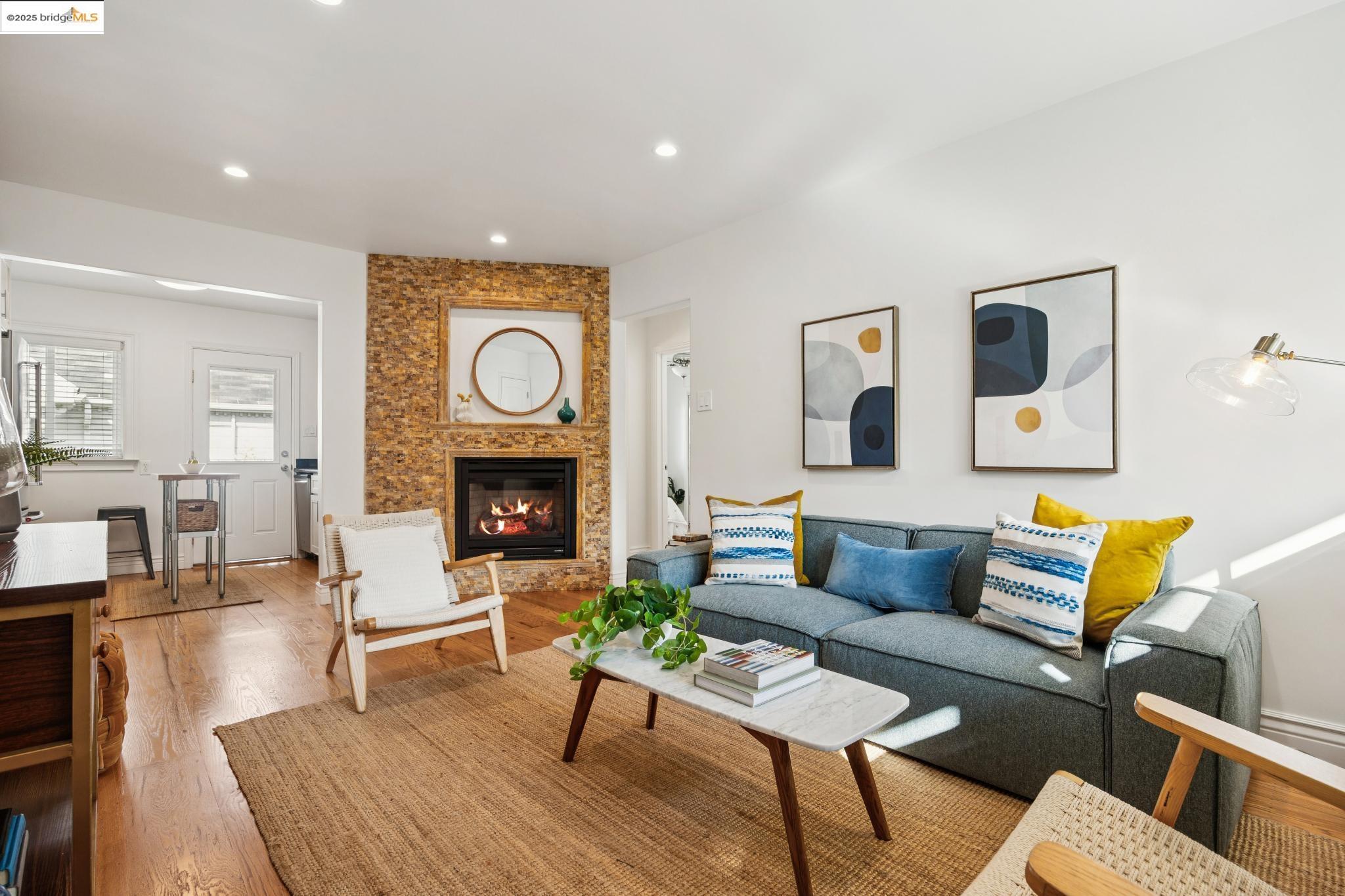 1609 Bonita Avenue, Unit 3 Berkeley, CA 94709 - Photo 1 of 10 a living room with furniture and a fireplace