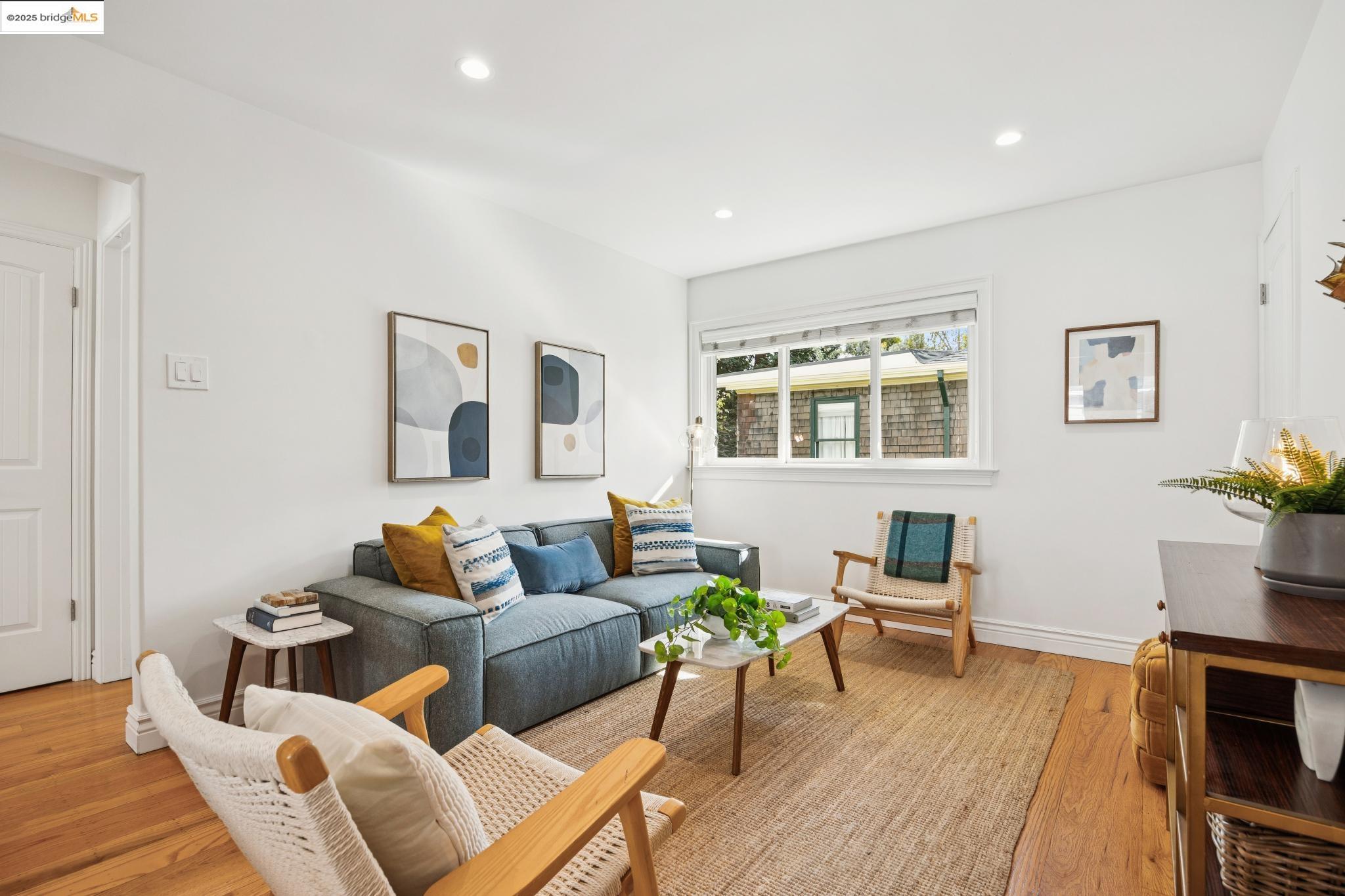 1609 Bonita Avenue, Unit 3 Berkeley, CA 94709 - Photo 2 of 10 a living room with furniture and wooden floor