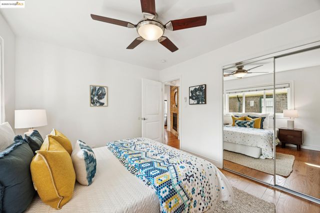 a bedroom with a bed couch and window