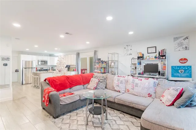 a living room with furniture and a large window