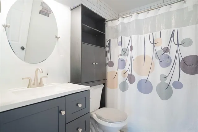 a view of a patio with table and chairs