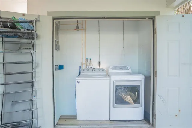 an aerial view of a house having swimming pool patio and lake view