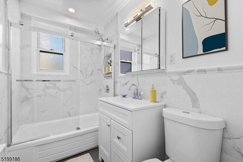 36 Hawthorne Place, Unit 2J Montclair, NJ 07042 - Photo 5 of 16 a bathroom with a sink toilet and shower