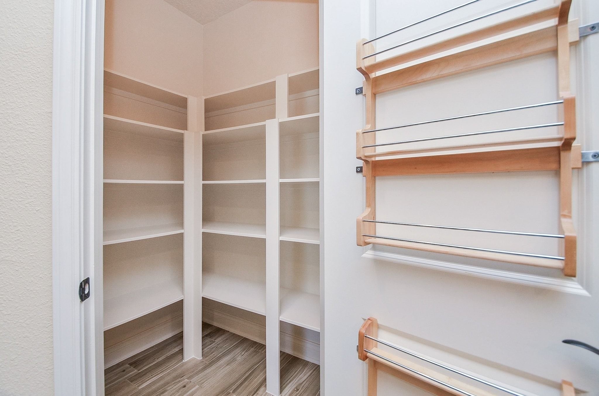 13327 Little Ranch Road Cypress, TX 77429 - Photo 20 of 49 a view of walk in closet with empty racks