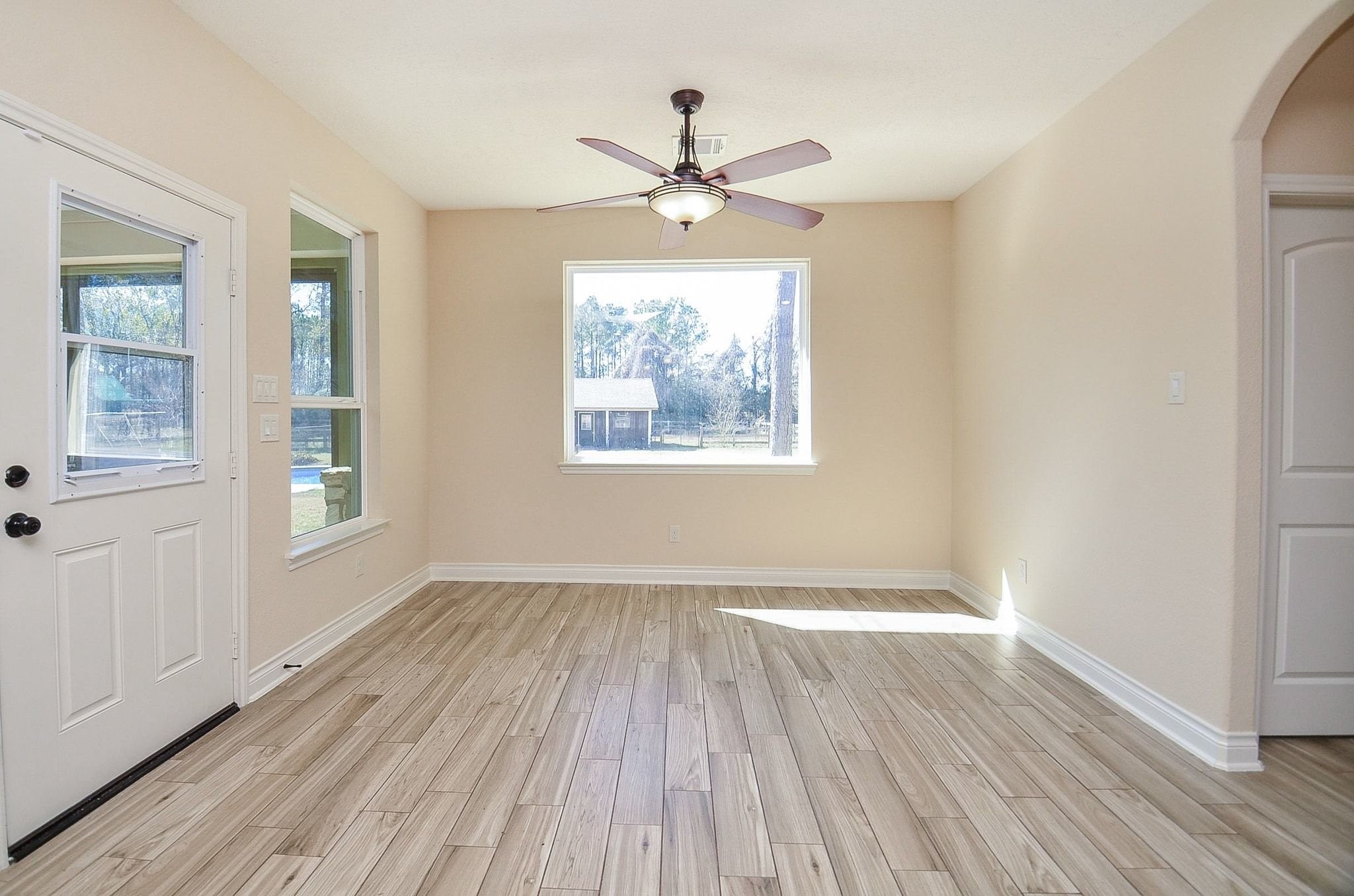 13327 Little Ranch Road Cypress, TX 77429 - Photo 21 of 49 wooden floor in an empty room with a window