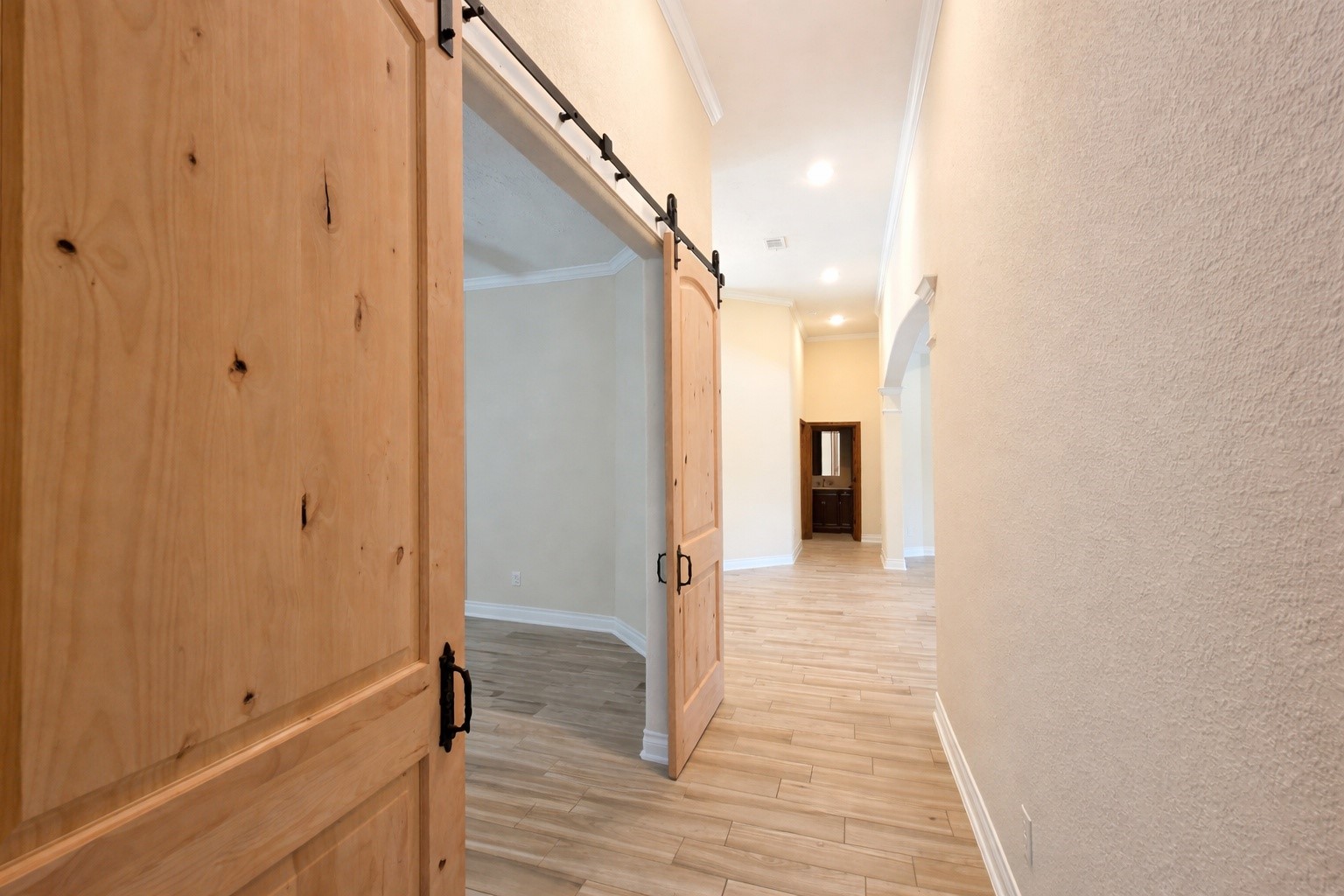 13327 Little Ranch Road Cypress, TX 77429 - Photo 23 of 49 a view of a hallway with wooden floor and staircase