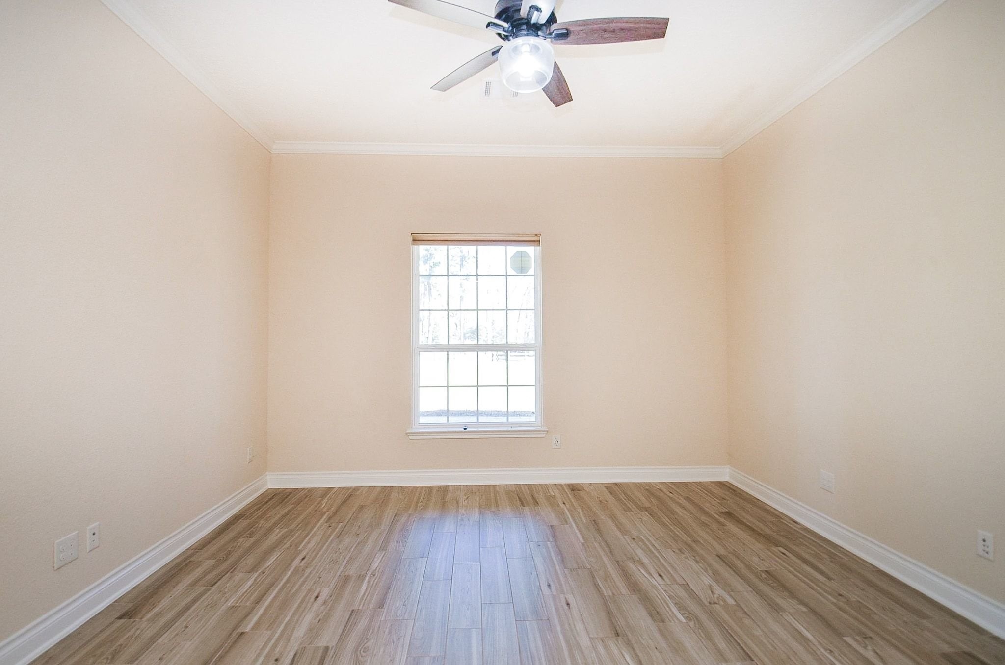 13327 Little Ranch Road Cypress, TX 77429 - Photo 26 of 49 an empty room with a window and wooden floor