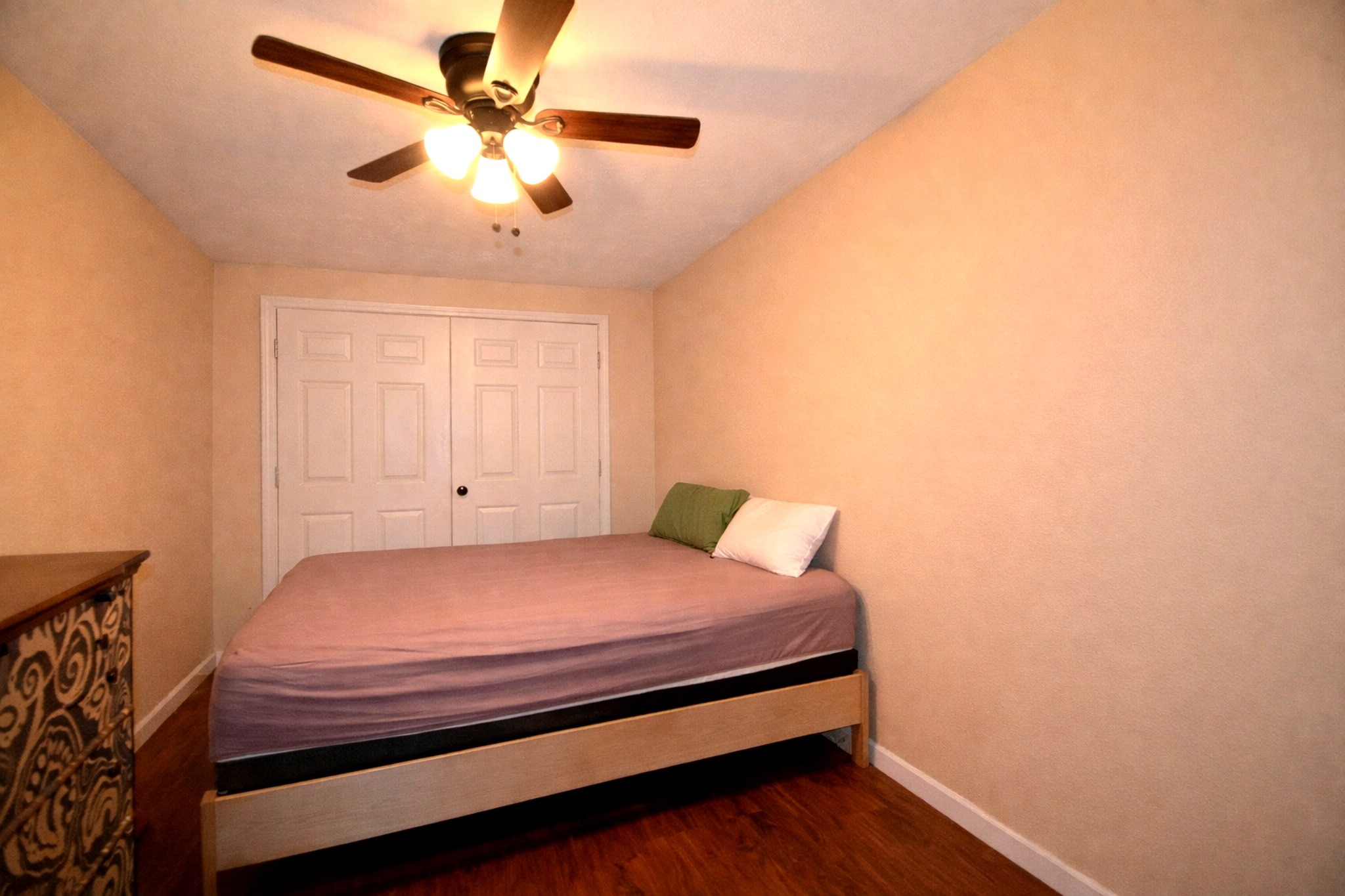 13327 Little Ranch Road Cypress, TX 77429 - Photo 44 of 49 a bedroom with a bed and a ceiling fan