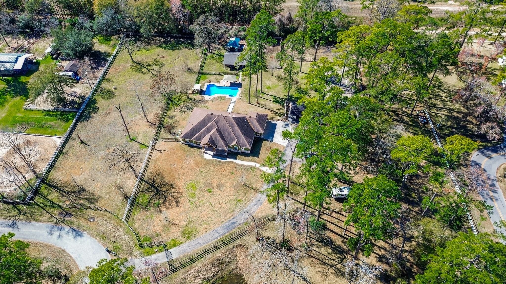 13327 Little Ranch Road Cypress, TX 77429 - Photo 47 of 49 Nestled on 4.4 acres, this inviting single-story home offers a quiet, private setting with plenty of room to enjoy outdoor living, recreation, and future possibilities.