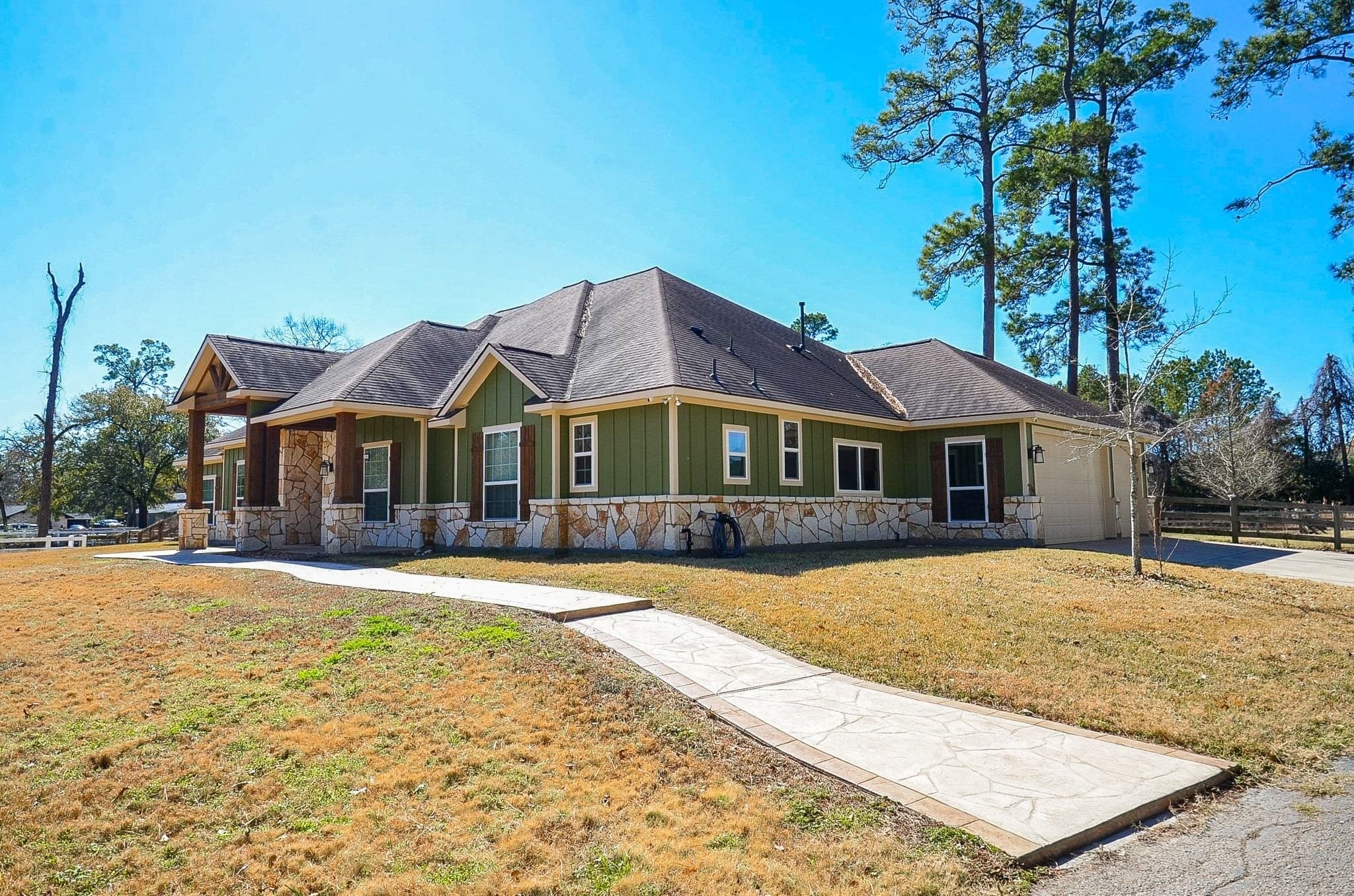 13327 Little Ranch Road Cypress, TX 77429 - Photo 5 of 49 a front view of a house with a yard