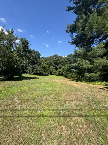 a view of an ocean and a yard