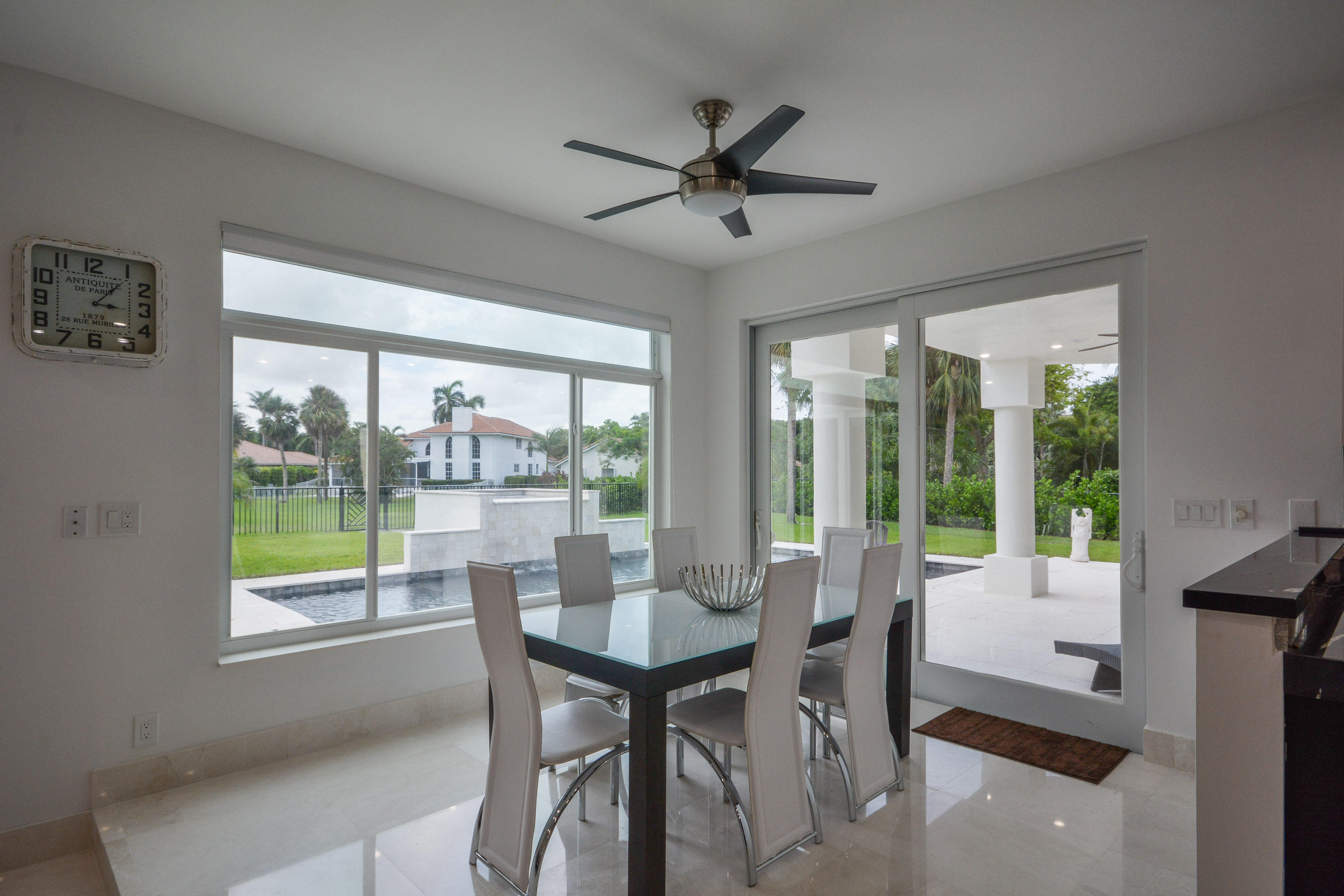 1041 Southwest 21st Avenue Boca Raton, FL 33486 - Photo 26 of 67 a view of a dining room with furniture window and outside view