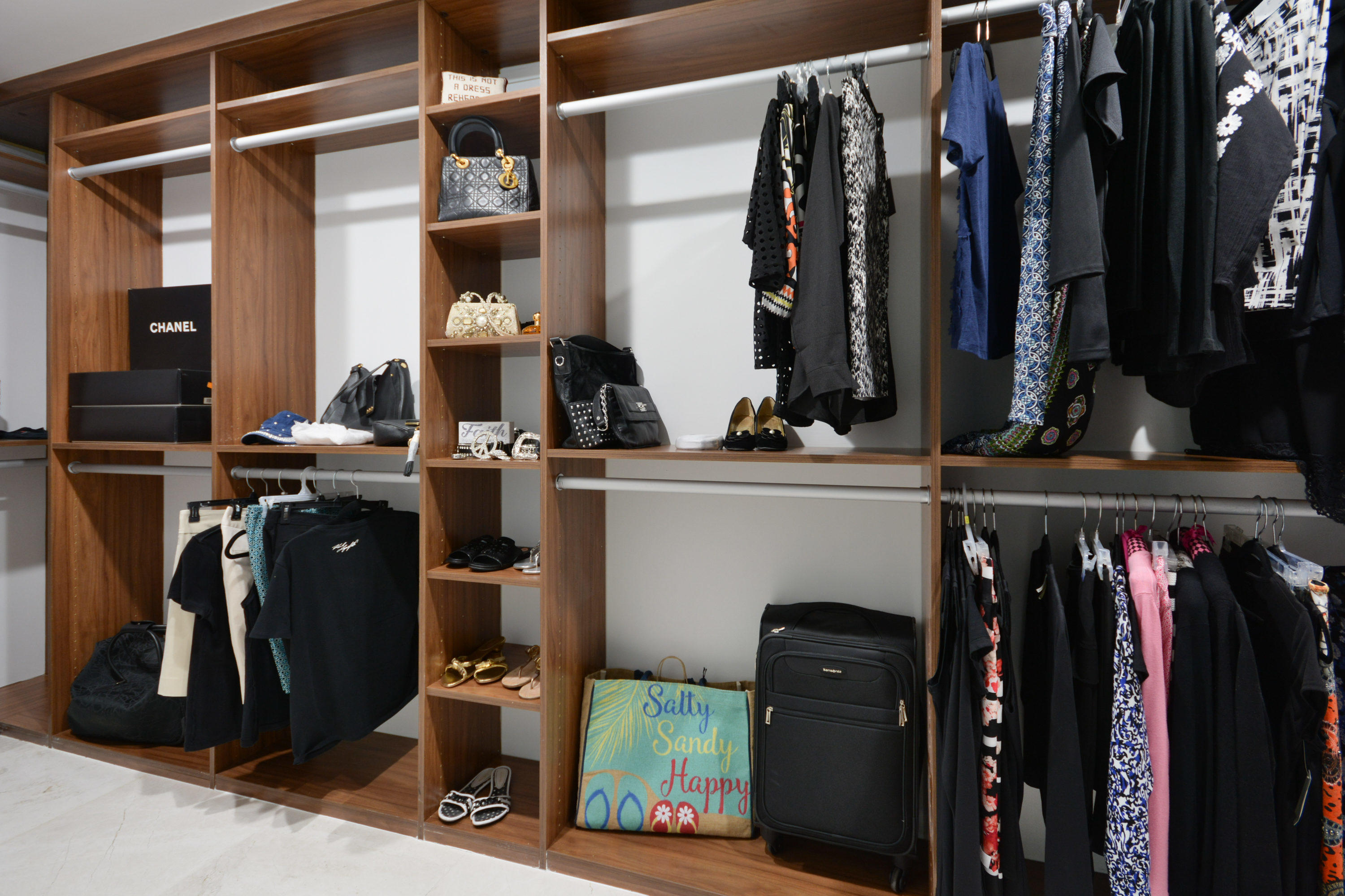 1041 Southwest 21st Avenue Boca Raton, FL 33486 - Photo 28 of 67 a view of walk in closet with clothes and shoes
