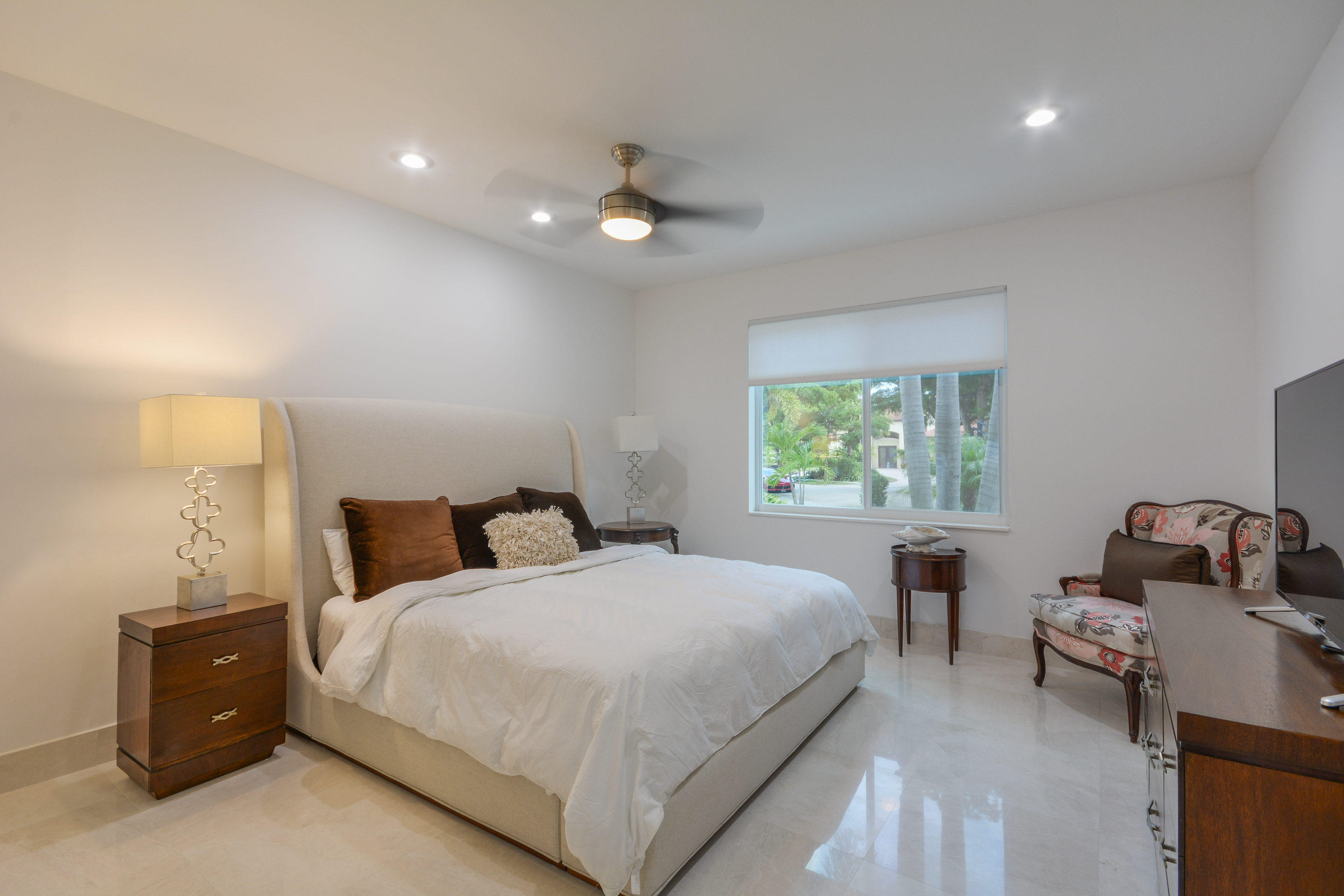 1041 Southwest 21st Avenue Boca Raton, FL 33486 - Photo 29 of 67 a bedroom with a bed and window