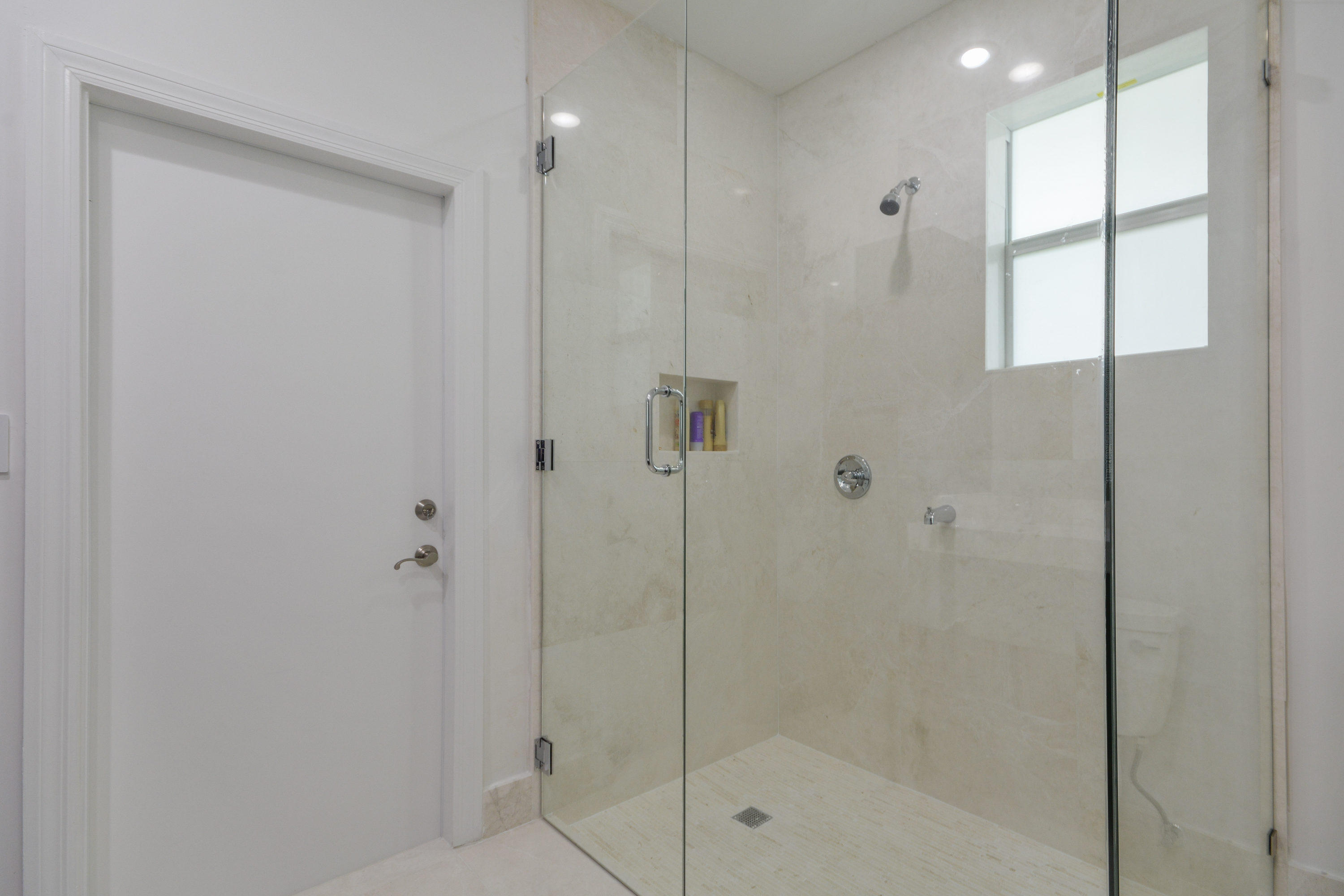 1041 Southwest 21st Avenue Boca Raton, FL 33486 - Photo 31 of 67 a bathroom with a shower