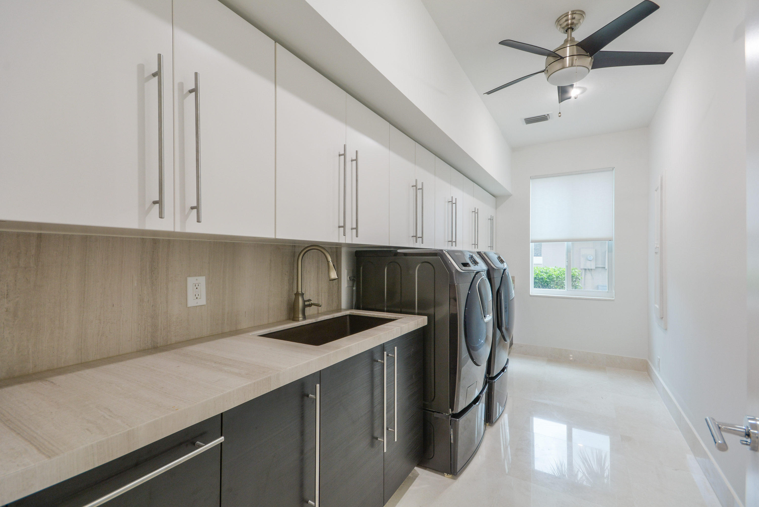 1041 Southwest 21st Avenue Boca Raton, FL 33486 - Photo 32 of 67 a kitchen with a sink a stove and a refrigerator