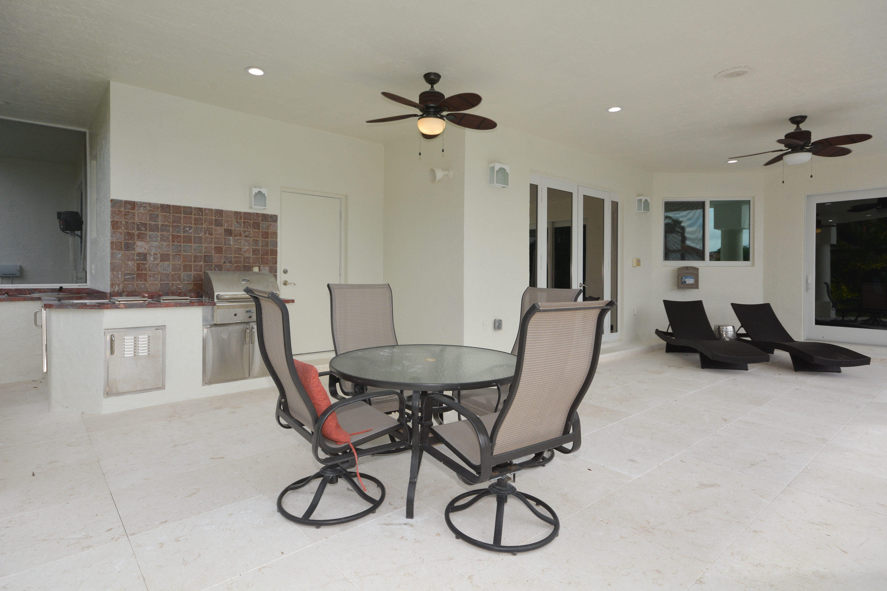 1041 Southwest 21st Avenue Boca Raton, FL 33486 - Photo 48 of 67 a view of a dining room with furniture