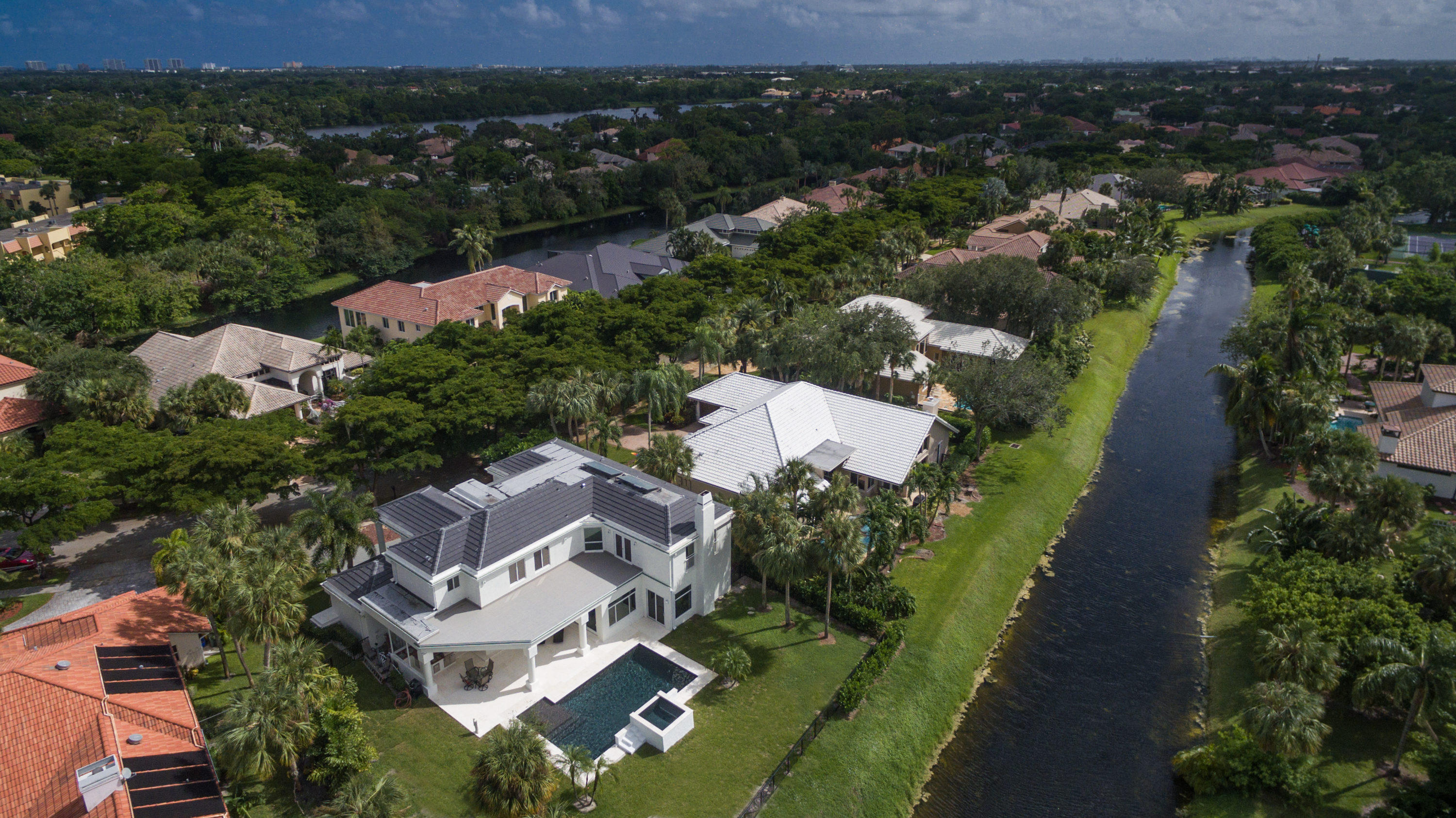 1041 Southwest 21st Avenue Boca Raton, FL 33486 - Photo 52 of 67 an aerial view of multiple houses with yard