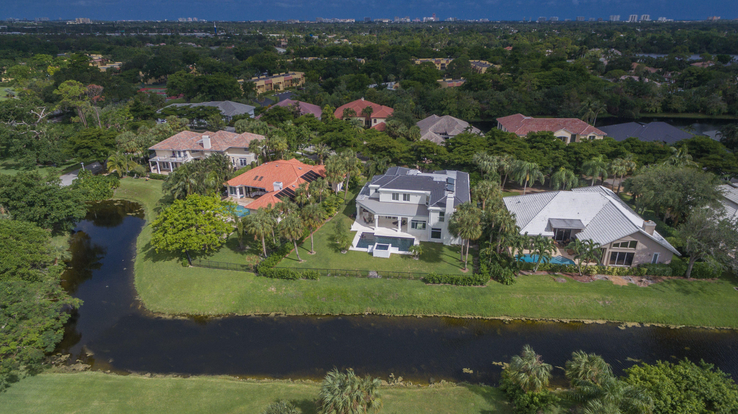 1041 Southwest 21st Avenue Boca Raton, FL 33486 - Photo 53 of 67 an aerial view of residential houses with outdoor space and trees