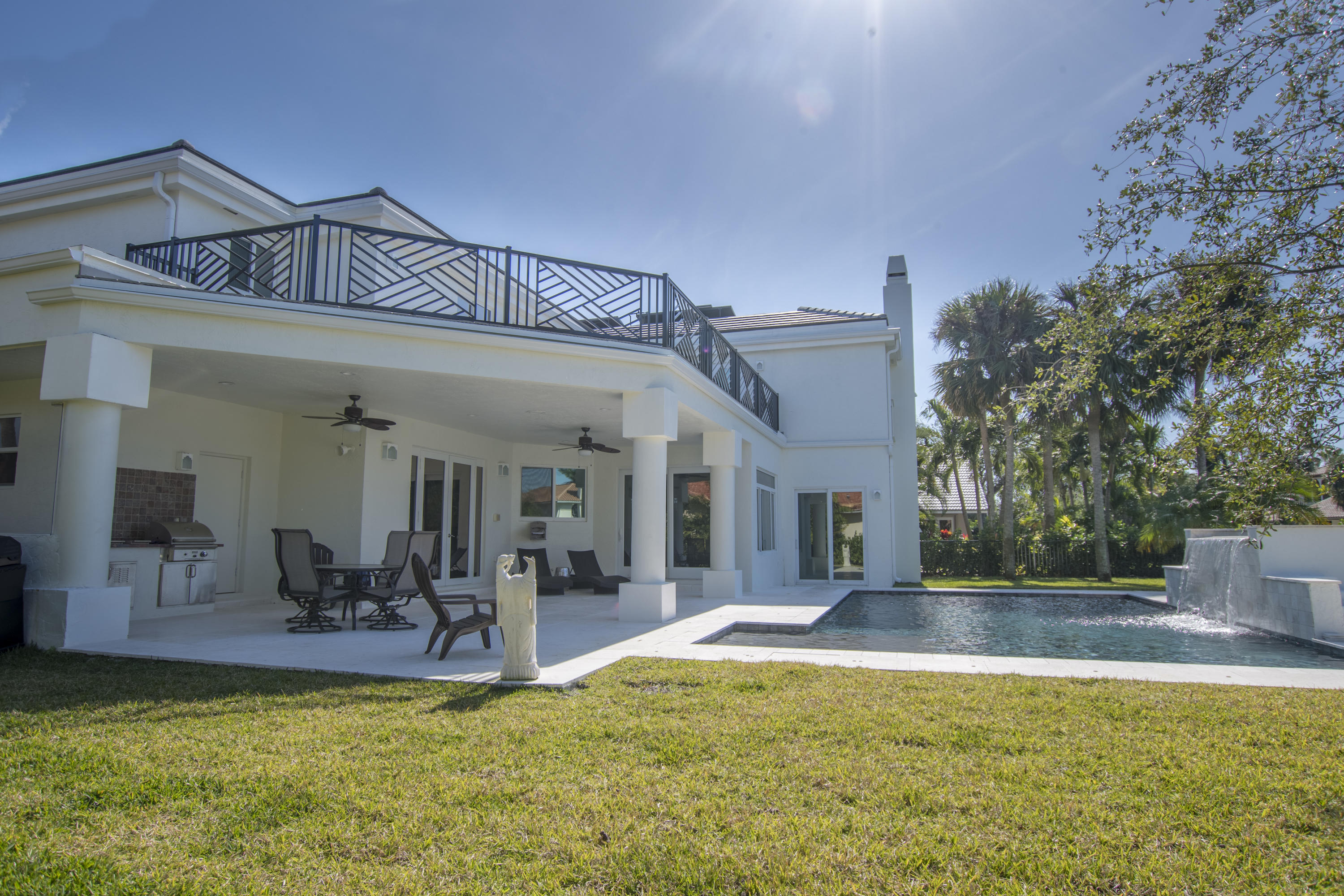 1041 Southwest 21st Avenue Boca Raton, FL 33486 - Photo 60 of 67 a view of a house with swimming pool and sitting area