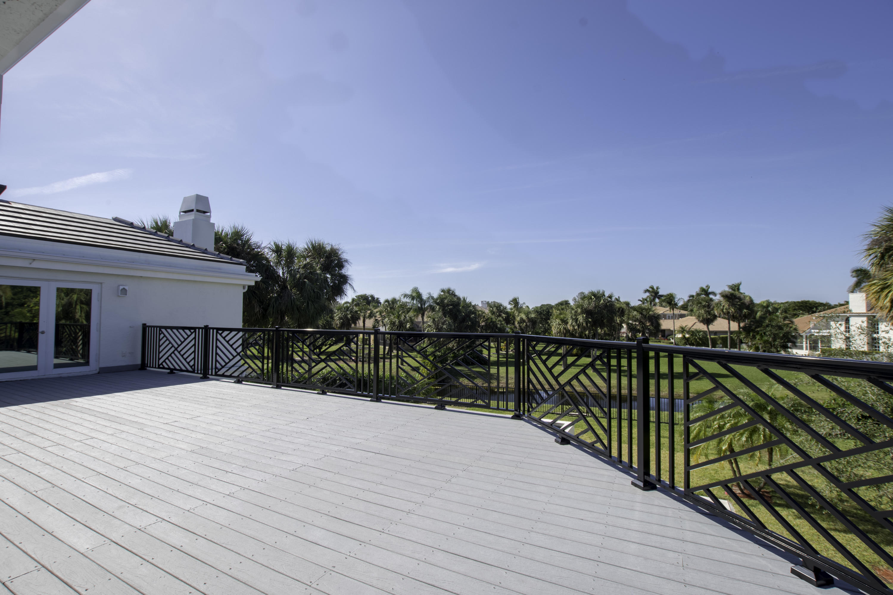 1041 Southwest 21st Avenue Boca Raton, FL 33486 - Photo 65 of 67 a view of a balcony with wooden floor