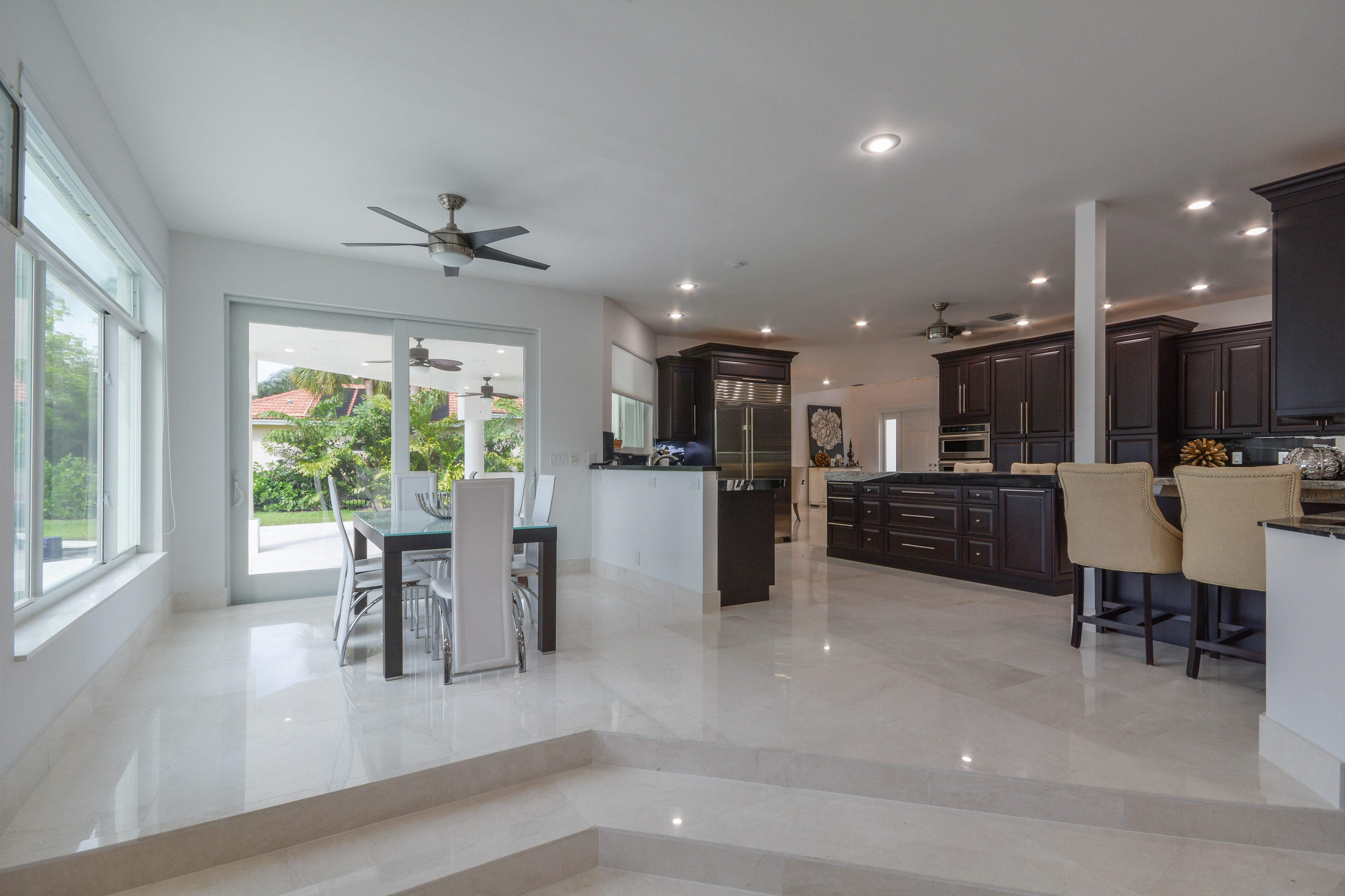 1041 Southwest 21st Avenue Boca Raton, FL 33486 - Photo 7 of 67 a view of a dining room with furniture window and outside view