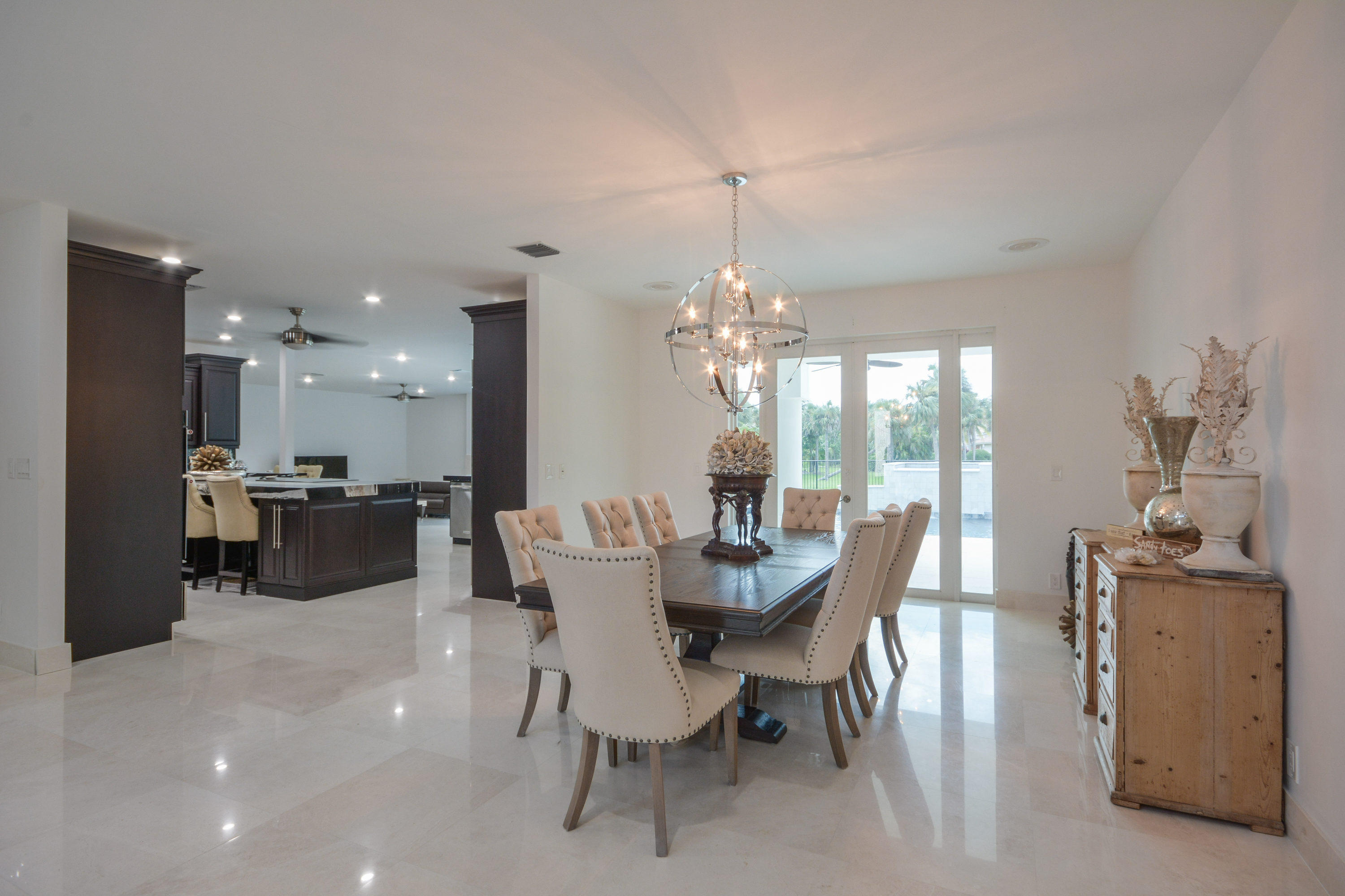 1041 Southwest 21st Avenue Boca Raton, FL 33486 - Photo 10 of 67 a view of a dining room with furniture and chandelier