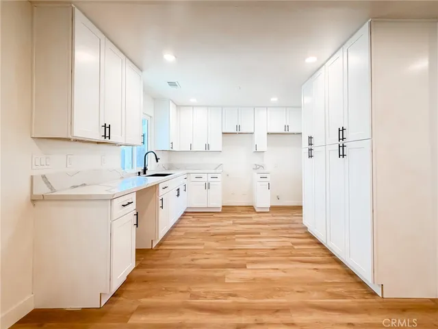 a view of kitchen with wooden floor