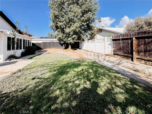 a view of house with yard