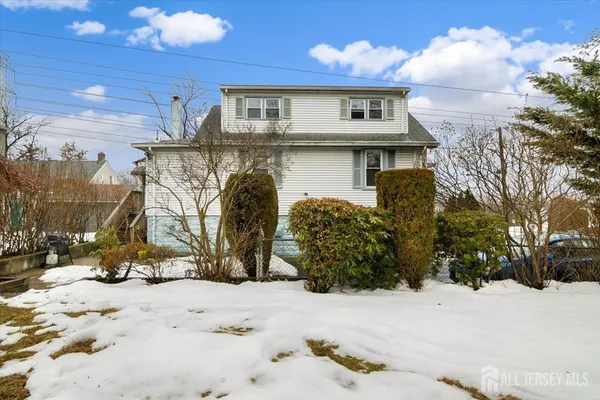 a view of a house with a snow in the yard
