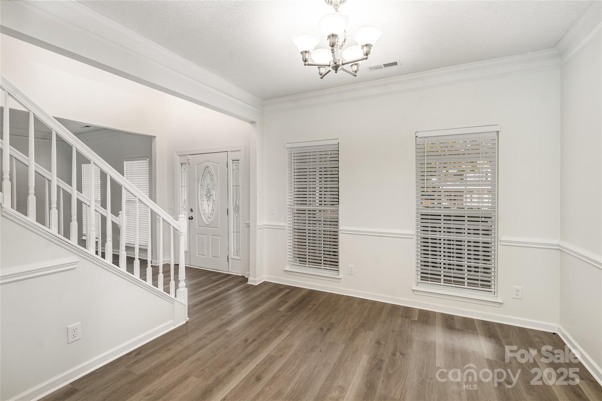 11422 Ridge Oak Drive Charlotte, NC 28273 - Photo 4 of 19 a view of an empty room with wooden floor and a window