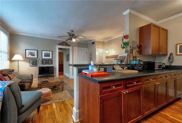 a kitchen with stainless steel appliances granite countertop a sink dishwasher stove and cabinets
