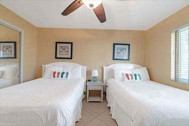 a view of a hallway to a livingroom with furniture