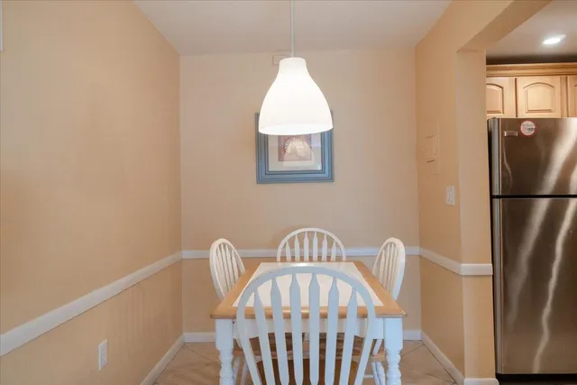 a living room with furniture a rug and a chandelier
