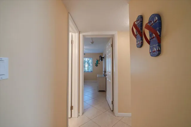 a bathroom with a sink toilet granite shower and a mirror