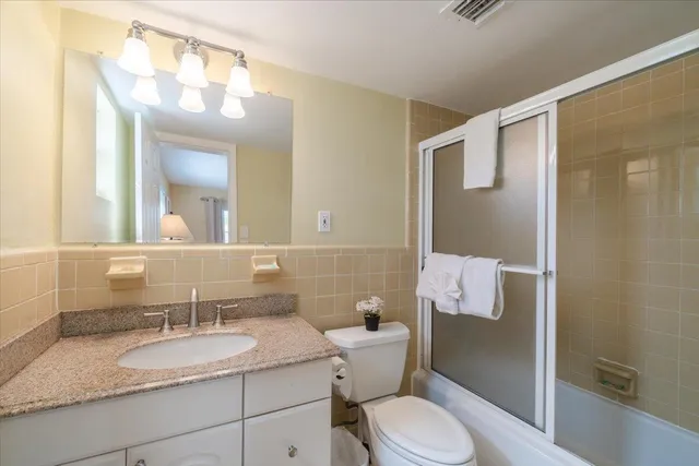 a view of a chairs and tables in the patio