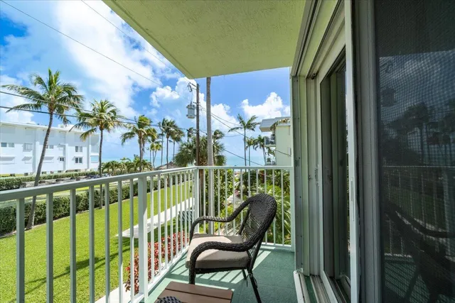 a view of backyard of house with outdoor seating