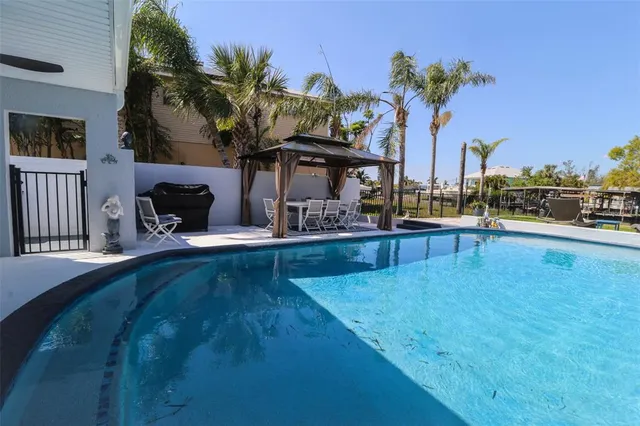 a living room with furniture and painting on the wall