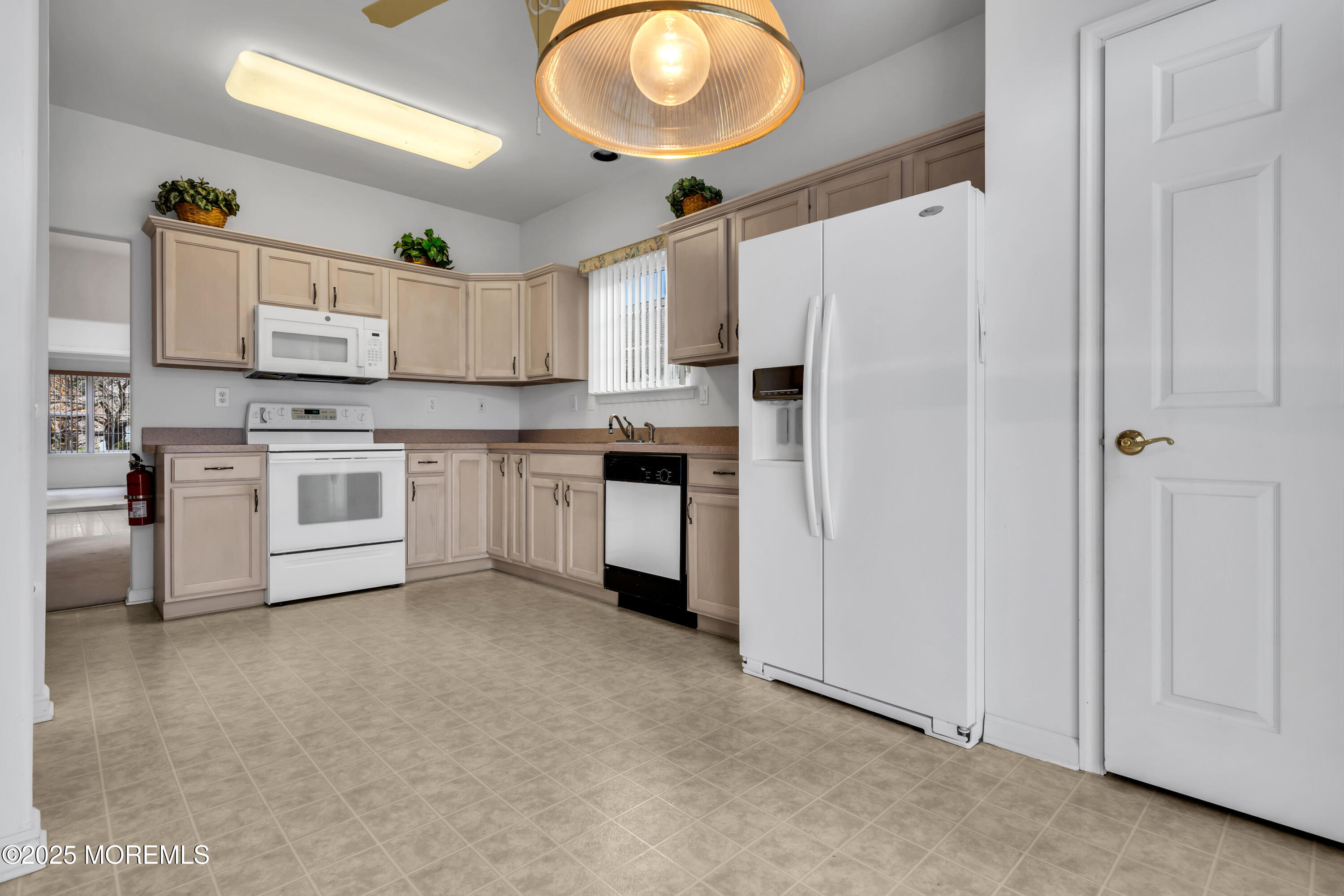 59 Drayton Road Manchester Township, NJ 08759 - Photo 12 of 38 a kitchen with cabinets and stainless steel appliances